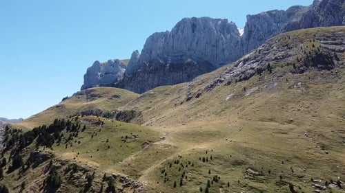 Aerial drone footage of the view of a mountainous natural and bright landscape.