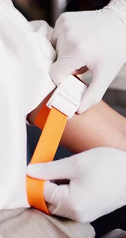 Person, hands and patient with arm strap for medical preparation, IV drip or injection
