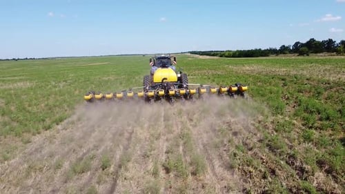 Blue Tractor O.A. Planting Canola On No Till Field