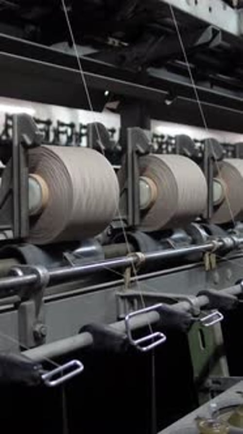 Industrial Thread Spools Rotating on Automated Machinery