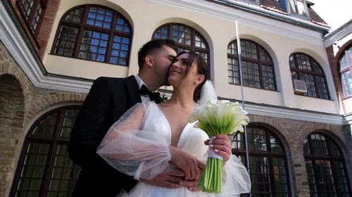 Happy Couple Embracing on Wedding Day