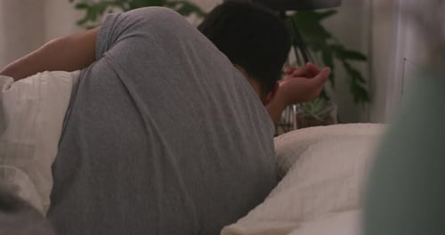 Man Sleeping Relaxing in his Bedroom