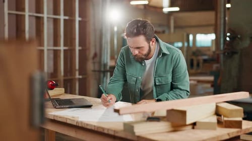 Carpentry, workshop and man on laptop writing for client woodwork orders