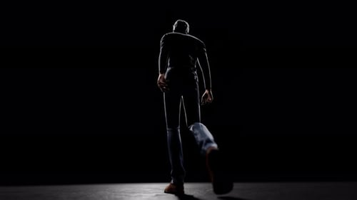 Man walking away in dark room sequence
