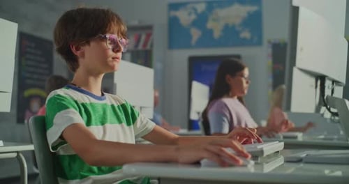 Focused Children Using Computers in School Computer Lab