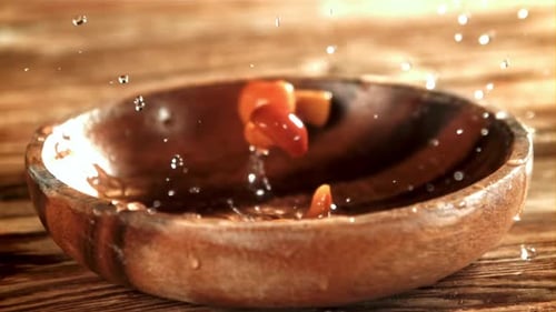 Pickled Mushrooms Fall Into a Wooden Bowl Filmed on a Highspeed Camera at 1000 Fps