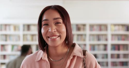 Smile, university and library with face of woman on campus for research, studying or learning
