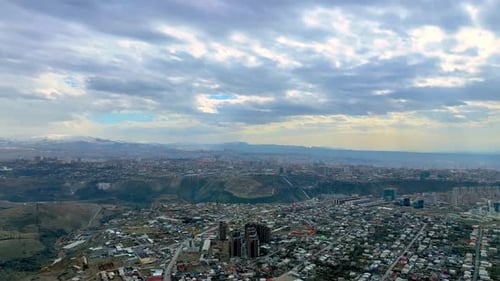 Aerial View of Yerevan City with Mountains in Background