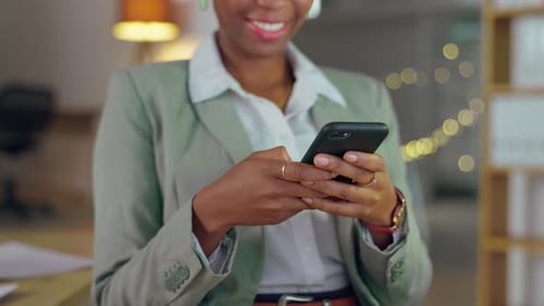 Black woman, hands and phone at night in business communication, texting or chatting at the office