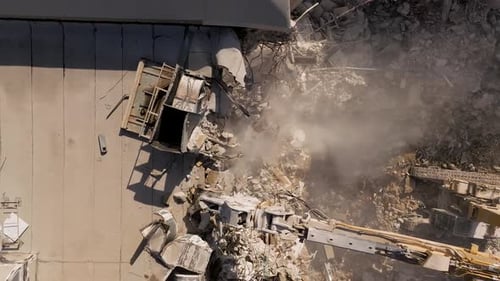 Building demolition excavator demolish a residential building