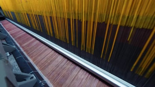 Carpet factory, carpet production, synthetic yarns for weaving loom. Electronic drive in rug weaving