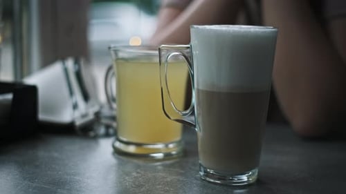 Latte and Sea Buckthorn Tea in Cafe