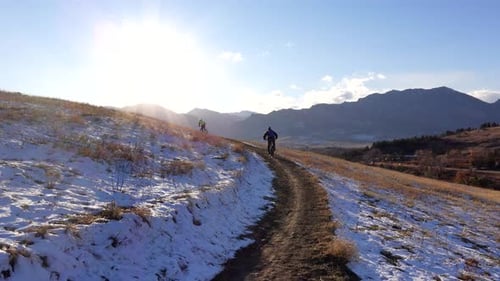 Mountain bikers riding a rural trail