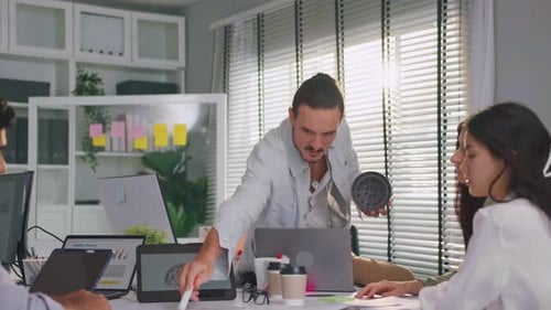 Group of Asian businessman and businesswoman working in the office.