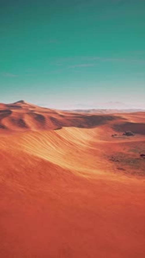 Red Desert Landscape Under Blue Sky