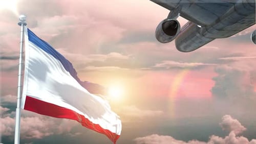 National Flag Waving with Airplane Flying in Sunset Sky