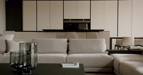 Modern Home Interior with Sofa and Sleek Kitchen