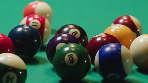 Colorful Balls with Numbers Closeup on Green Billiards Table for Start to Play American Pool Poule