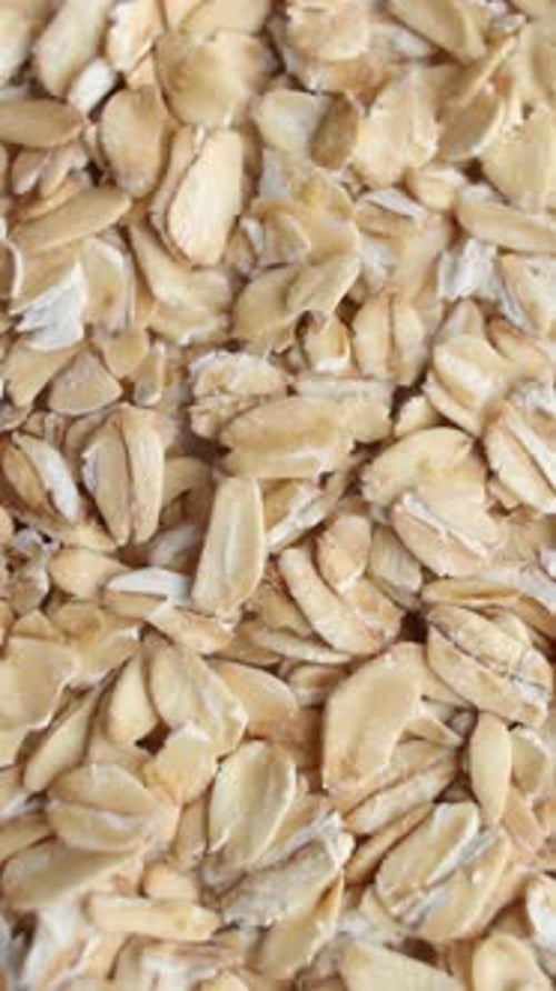 Background of Oats Grains Rotating Close Up Top View Vertical Video