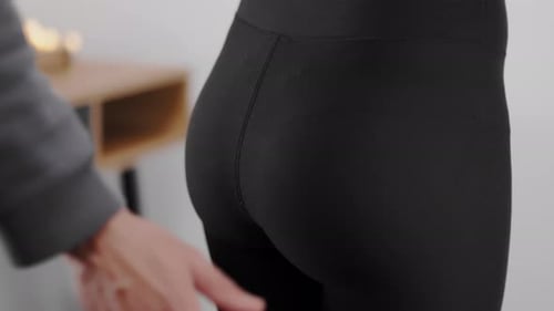 Man Slap And Touch The Butt Of Sexy Woman. - close up