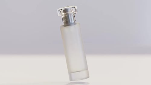 Elegant perfume bottle on white background with soft lighting