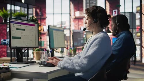 Call Center Team of Agents Wearing Headset Assisting Customers