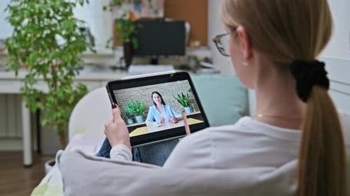 Woman Video Calling on Tablet in Bright Home