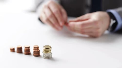 Business, People, Finances, Money Saving and Economy Concept - Close Up Of