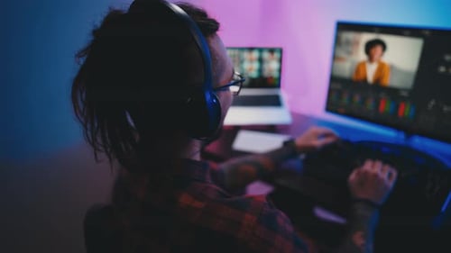 Person Using Video Editing Software at Night