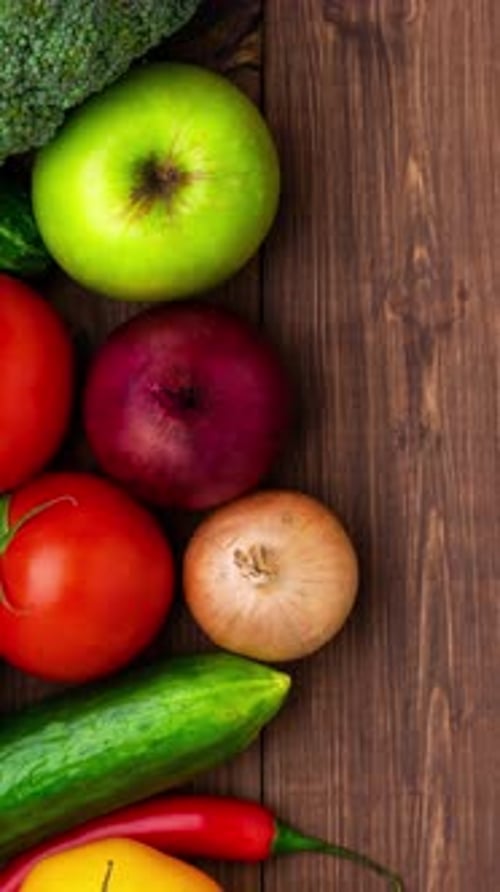 Fresh Fruits and Vegetables on Wooden Background