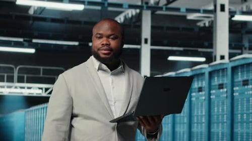 Data Center System Administrator Reviewing Code for Automation Scripts