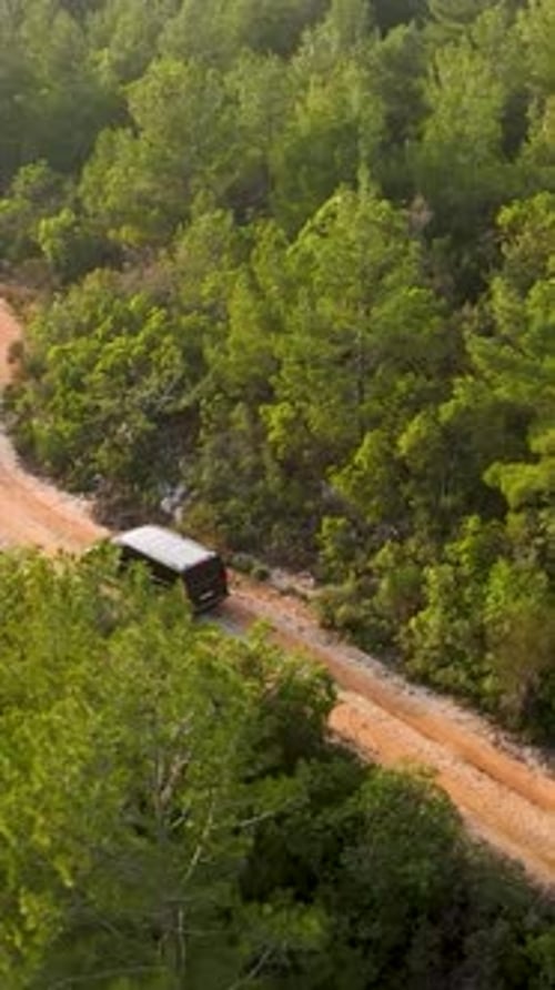 Vertical Video Cinematic Enchantment Aerial View of Luxurious Car Discovering the Mysteries of the