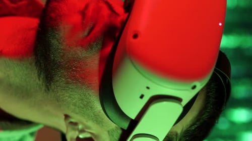 Red and Green Lights Portrait of Man with Vr Glass in Metaverse Virtual Reality Vertical Video