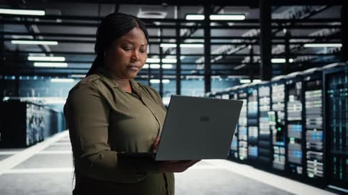 Data Center Engineer Upgrades Server Infrastructure Using Green Screen Laptop