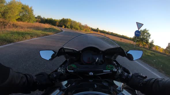 Point of View of a Motorcycle Rider Rides in Rural Road at Sunset Time ...