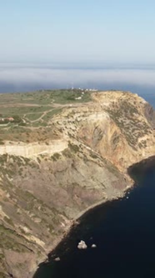 Aerial Vertical View of Seascape with Crystal Clear Calm Azure Sea and Rocky Shores A Beautiful