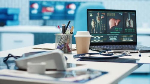Empty Medical Office with Computer and Diagnostic Tools Set Up for Consultations