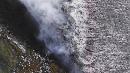 Aerial View of Dettifoss Waterfall Cascading Into Rocky Gorge