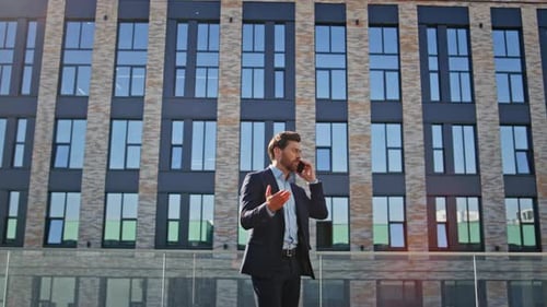 Confident Businessman Talking on the Phone Outdoors