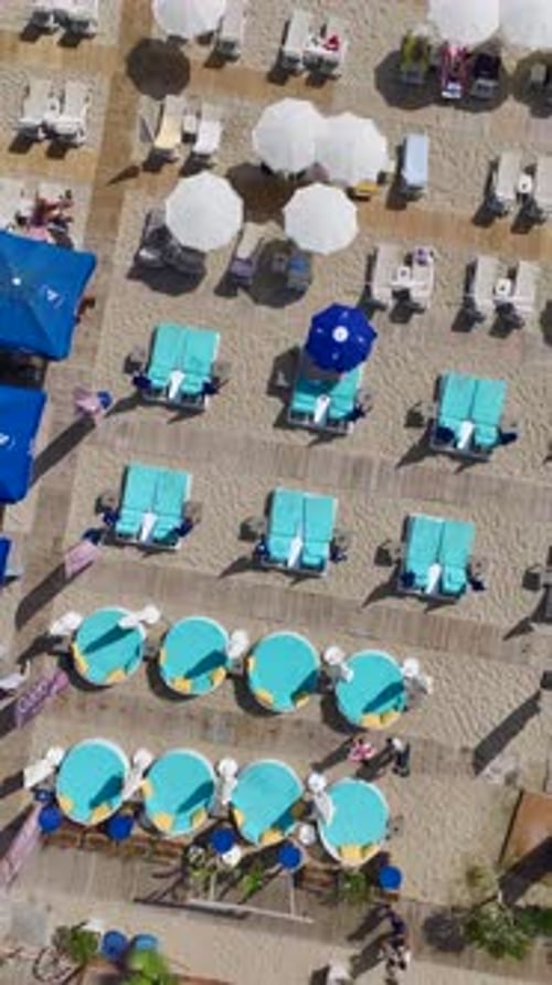 Vertical Video Scenic Beach With Soft White Sand and Azure Waters Perfect for a Peaceful Escape