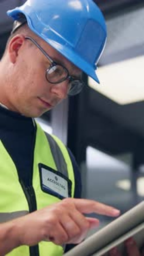 Tablet, man and contractor on site for planning, research or inspection on building maintenance