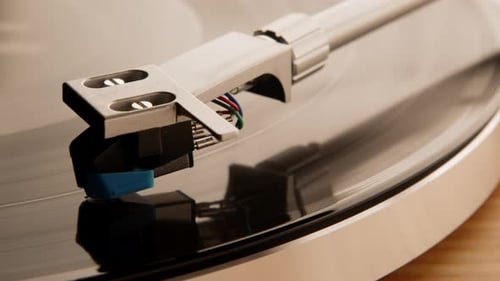 Detailed Close Up of a Vintage Record Player's Needle on a Spinning Vinyl Album
