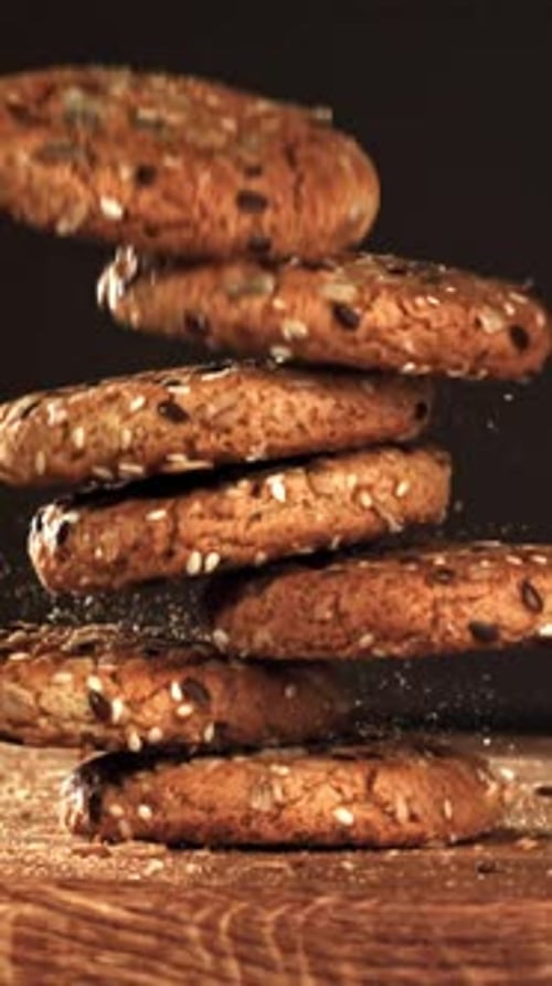 Oatmeal Cookies Fall on a Wooden Board Filmed on a Highspeed Camera at 1000 Fps