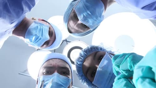 Medical Team Examining Patient in Hospital Operating Room