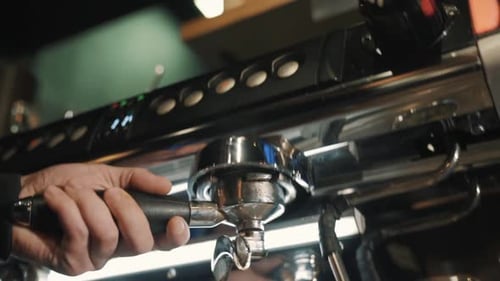 Pouring coffee stream from professional machine in cup. using filter holder. 120F