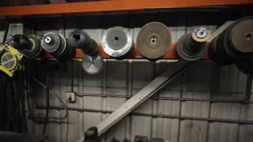 Pan across assorted tools hanging on wall in shop