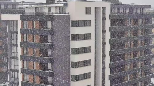 Residential building during heavy snowfall