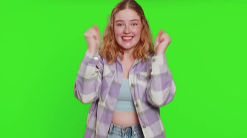Excited Young Woman Gestures on Green Screen
