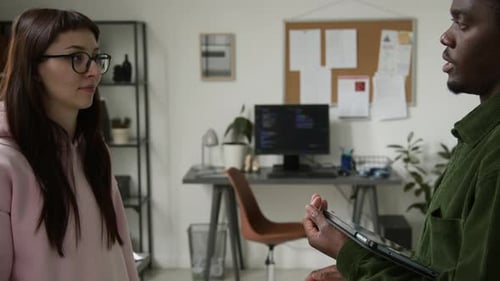 Female Supervisor Praising Junior Male Web Developer with Fist Bump