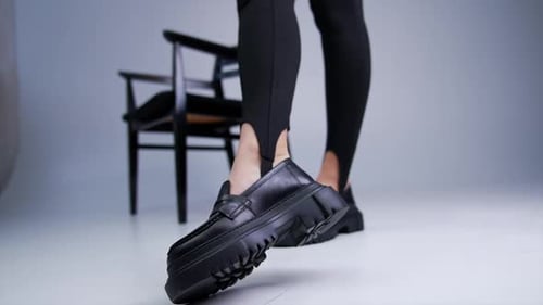 Woman Posing in Stylish Chunky Black Loafers